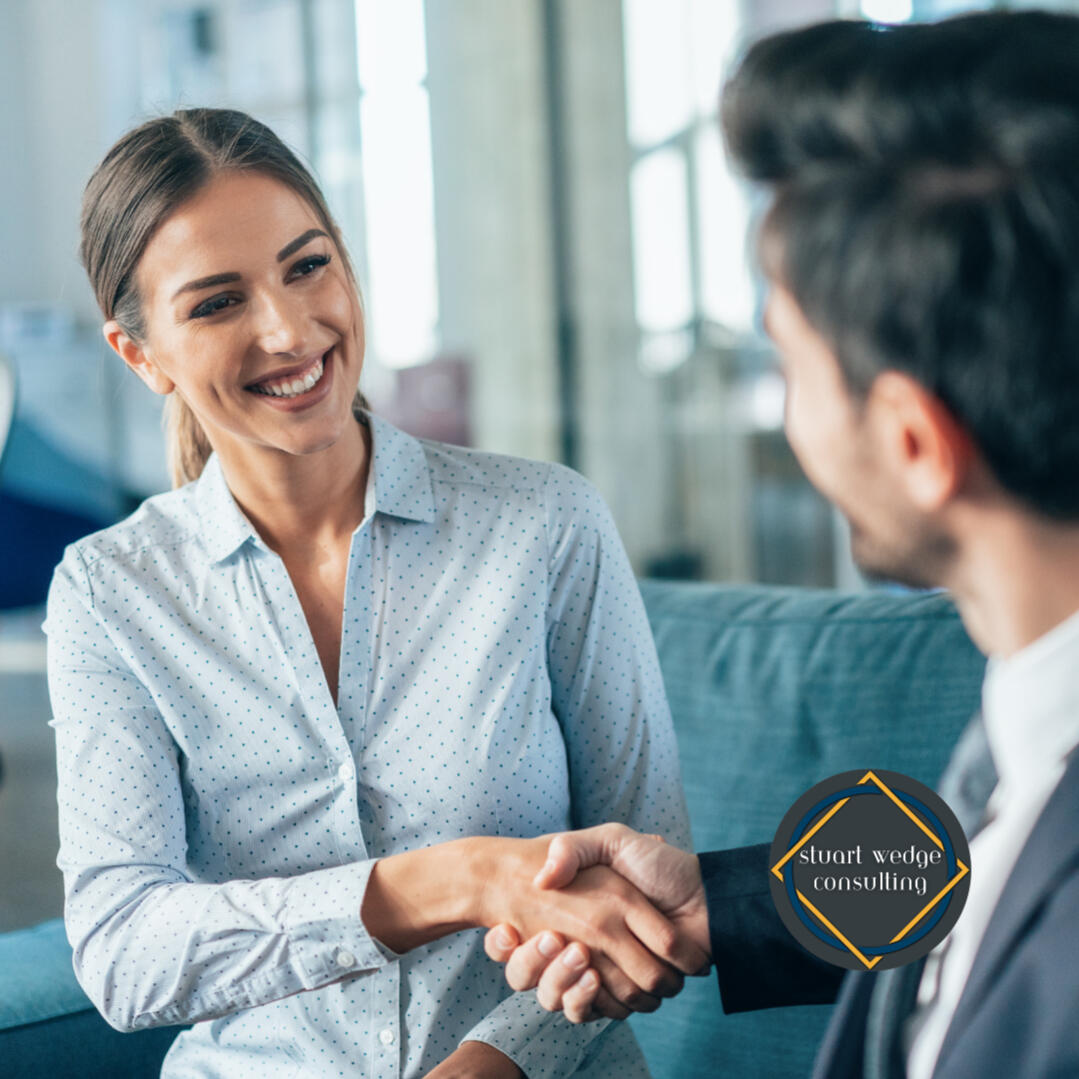 Stakeholder Alignment Sprint A picture of a woman shaking hands with a man in a suit